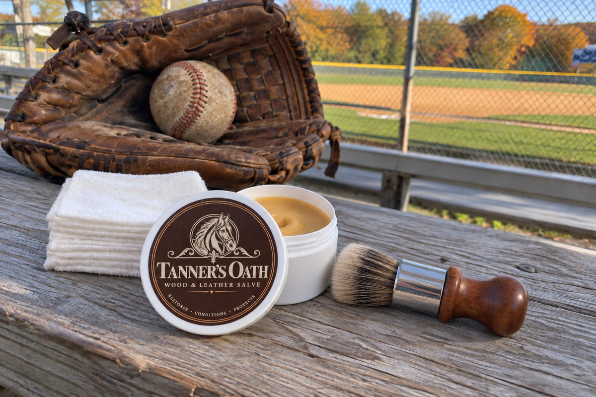 Tanner's Oath jar with free brush and wipes, a baseball glove behind