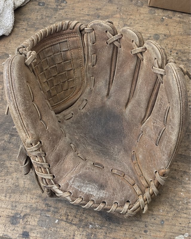 Illustration: A fielder's glove on a workbench, before