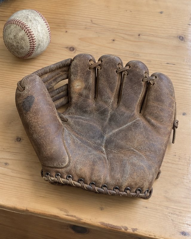 Illustration: A glove from the 1950s on a pine chest, before