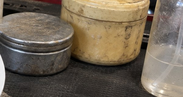 Tins of heavy leather wax, greyed out