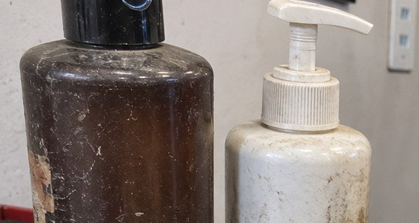 Bottles of thin leather conditioner, greyed out