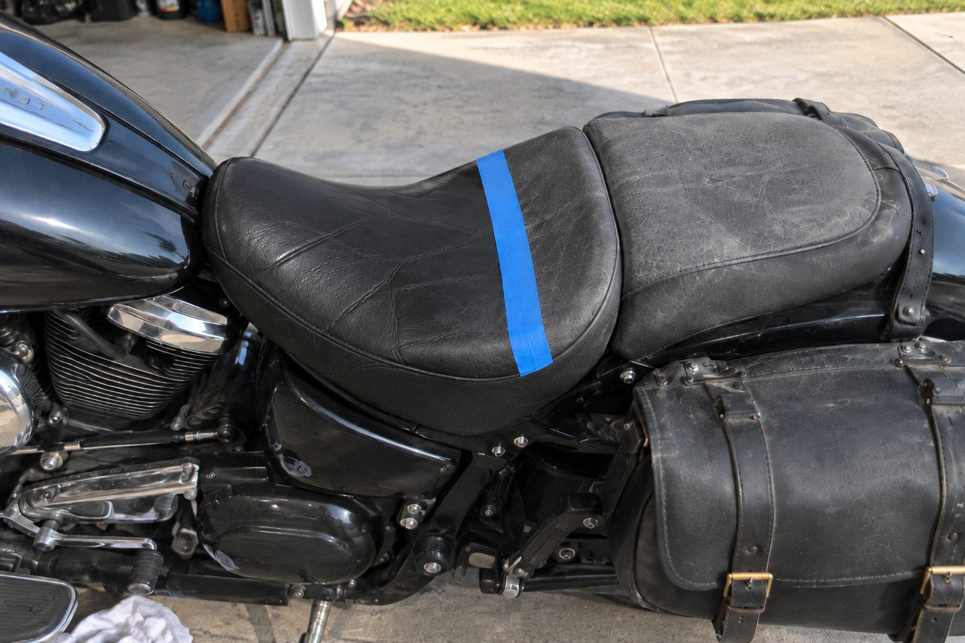 A leather seat taped across the middle, treated on one side and grey on the other