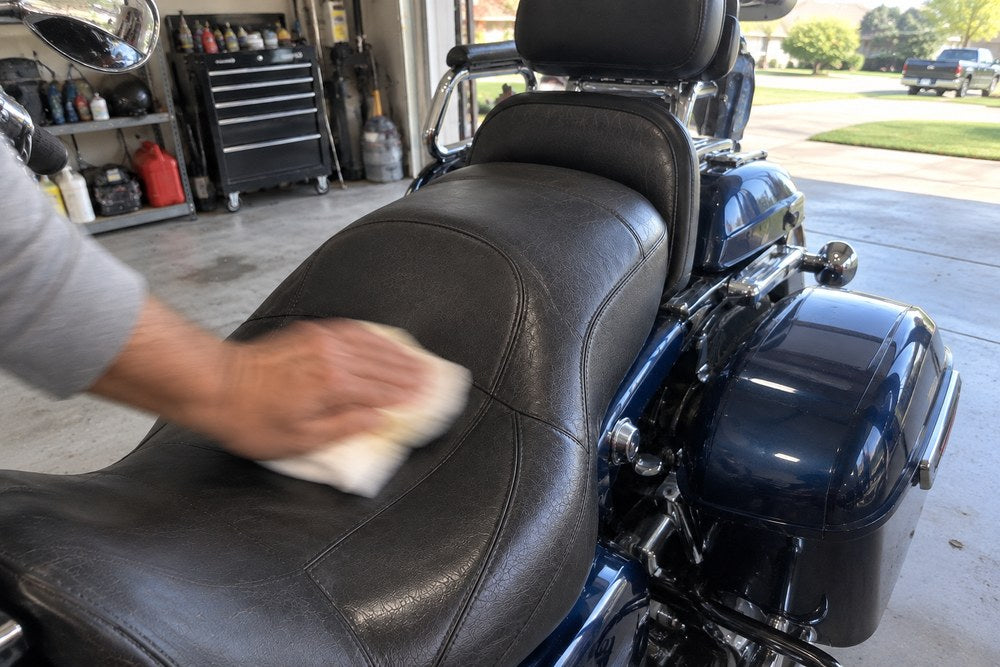 Buffing the seat dry with a clean cloth