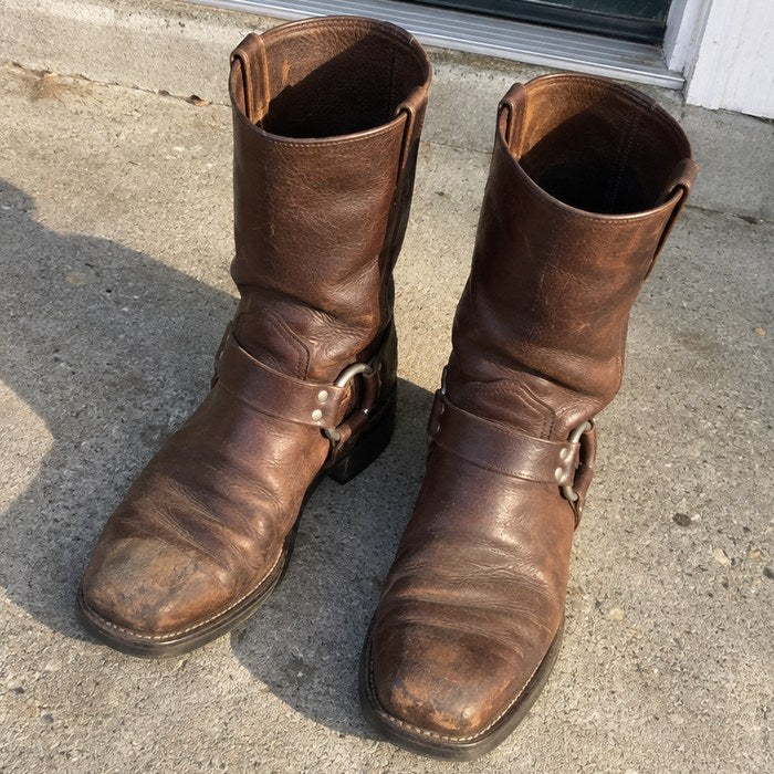 Brown leather harness boots on a front step